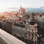 Sunlit panoramic view of Madrid’s city center with the Metropolis Building in the foreground