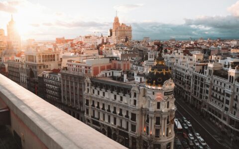 Sunlit panoramic view of Madrid’s city center with the Metropolis Building in the foreground