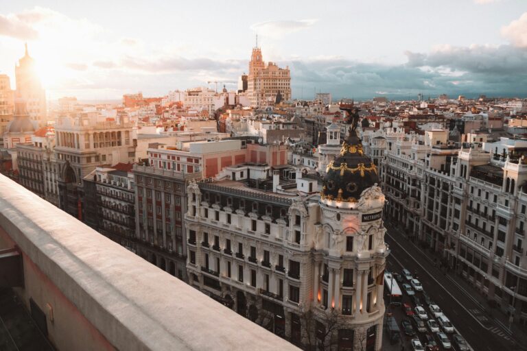 Sunlit panoramic view of Madrid’s city center with the Metropolis Building in the foreground