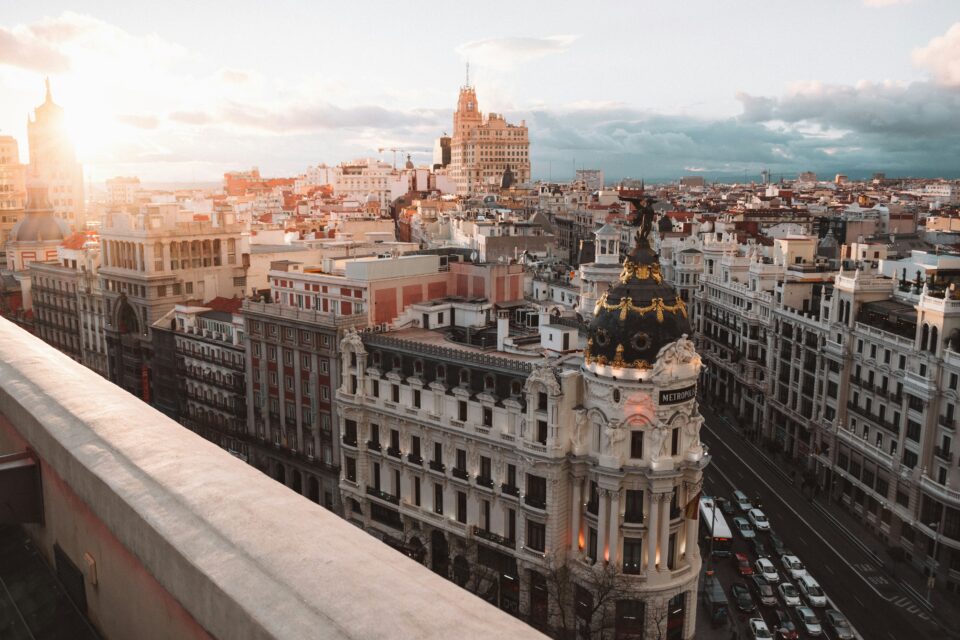 Sunlit panoramic view of Madrid’s city center with the Metropolis Building in the foreground